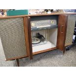 Mid century stereo cabinet containing Stereophonic radio receiver and Monarch turntable