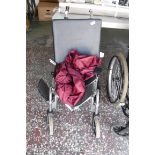 Folding wheelchair with rain cover