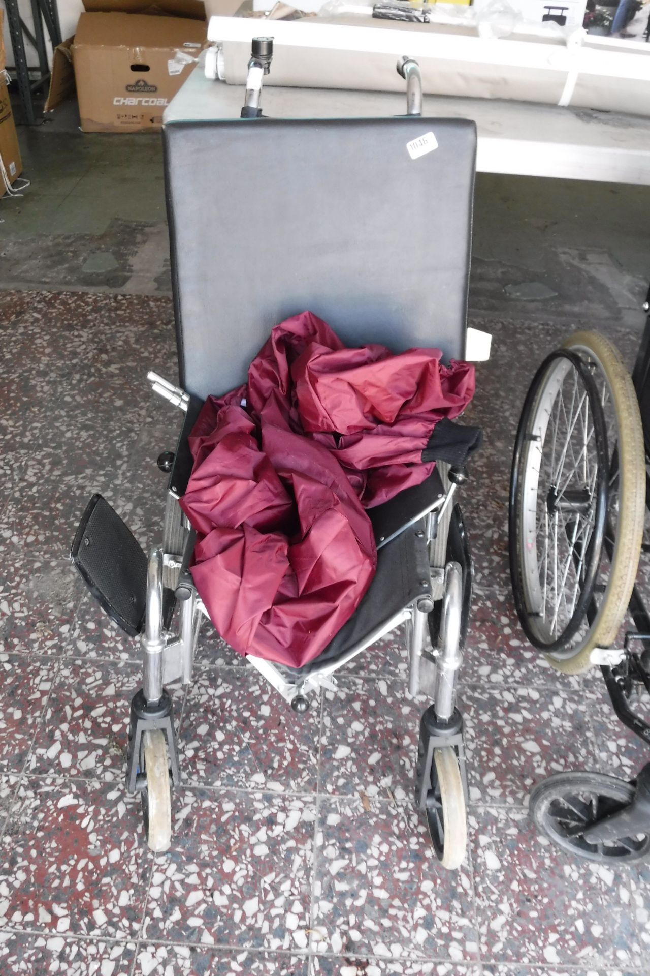 Folding wheelchair with rain cover