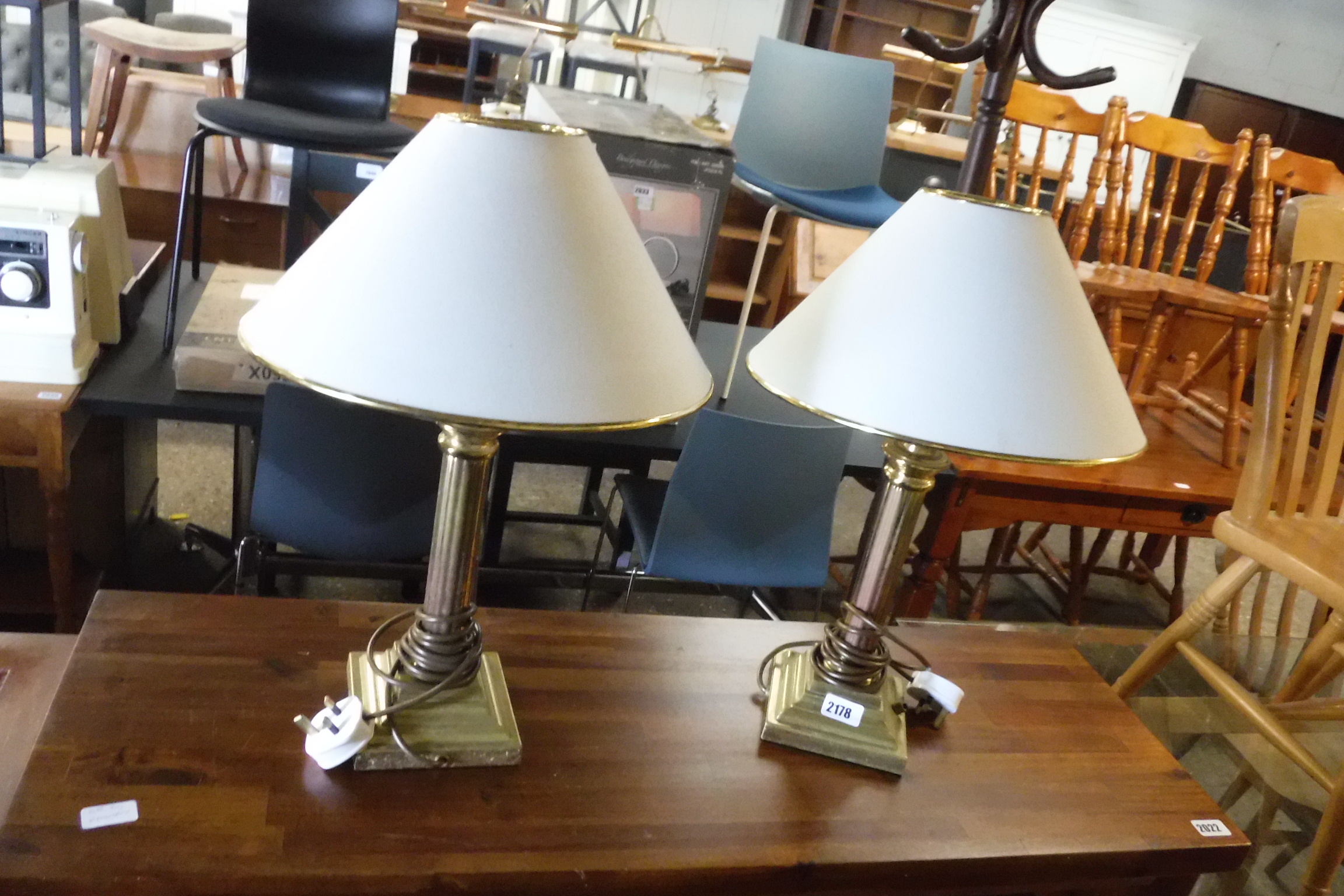 Pair of brass table lamps with tapered white shades