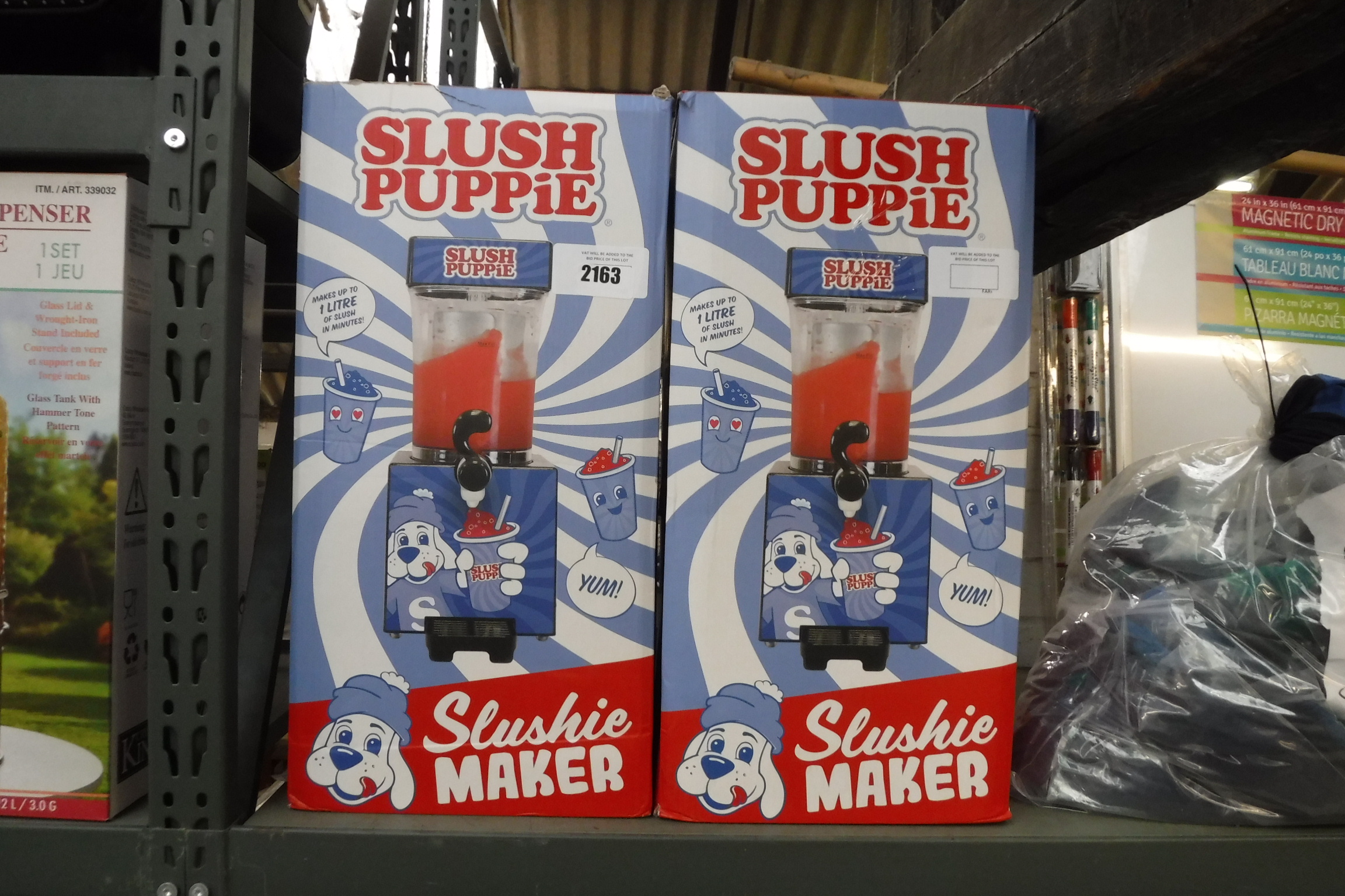 2 boxed slush puppy machines