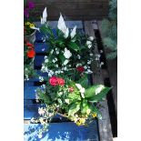 2 concrete planters of mixed plants incl. daisies and small roses