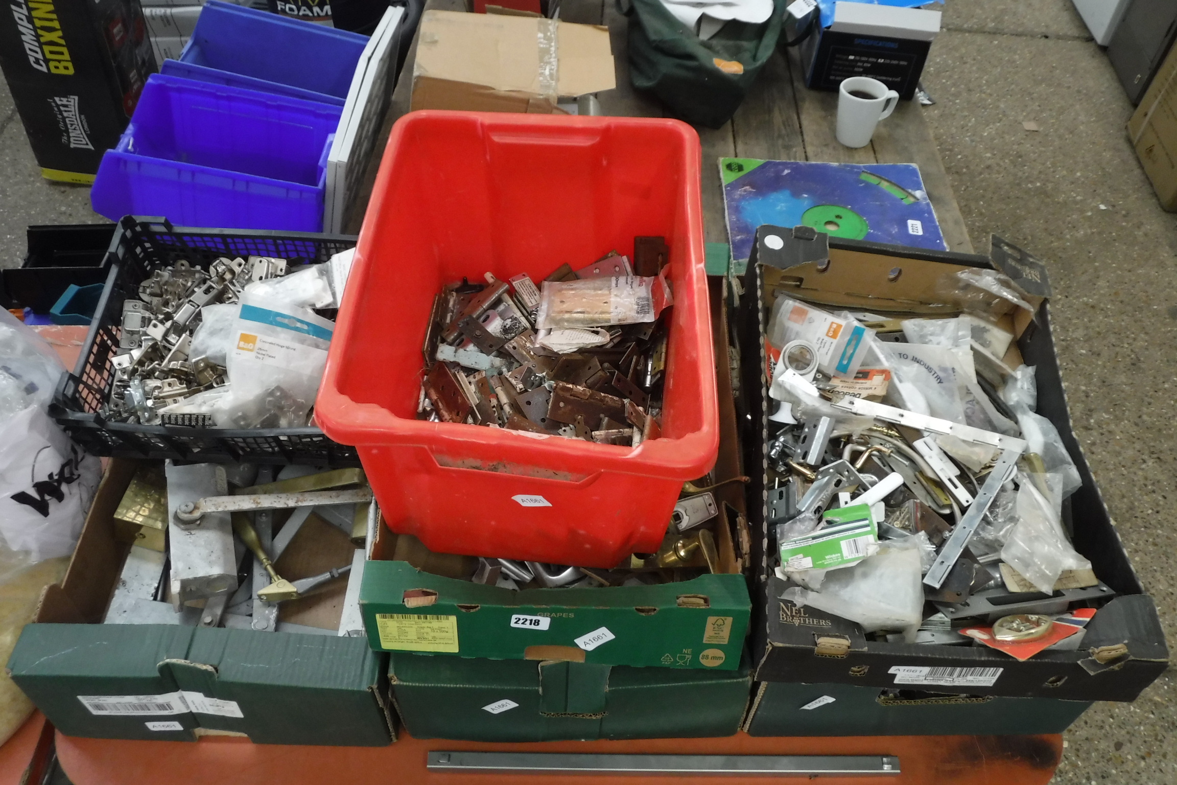 Approx. 7 trays of various door closers, hinges, other ironmongery, etc.