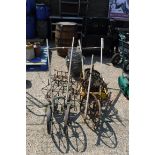 Selection of old agricultural push hoes and metal baskets and assortment of accessories