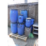 Pallet of blue tubs with lids and 1 dustbin