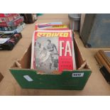 Box containing football magazines and books