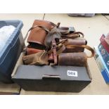 Box containing leather and canvas camera cases