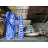 Cage containing blue and white jugs, lidded pot plus 2 chargers