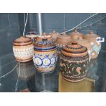 (376) Six Doulton Silicon ware tobacco jars of barrel shaped form, each relief decorated with