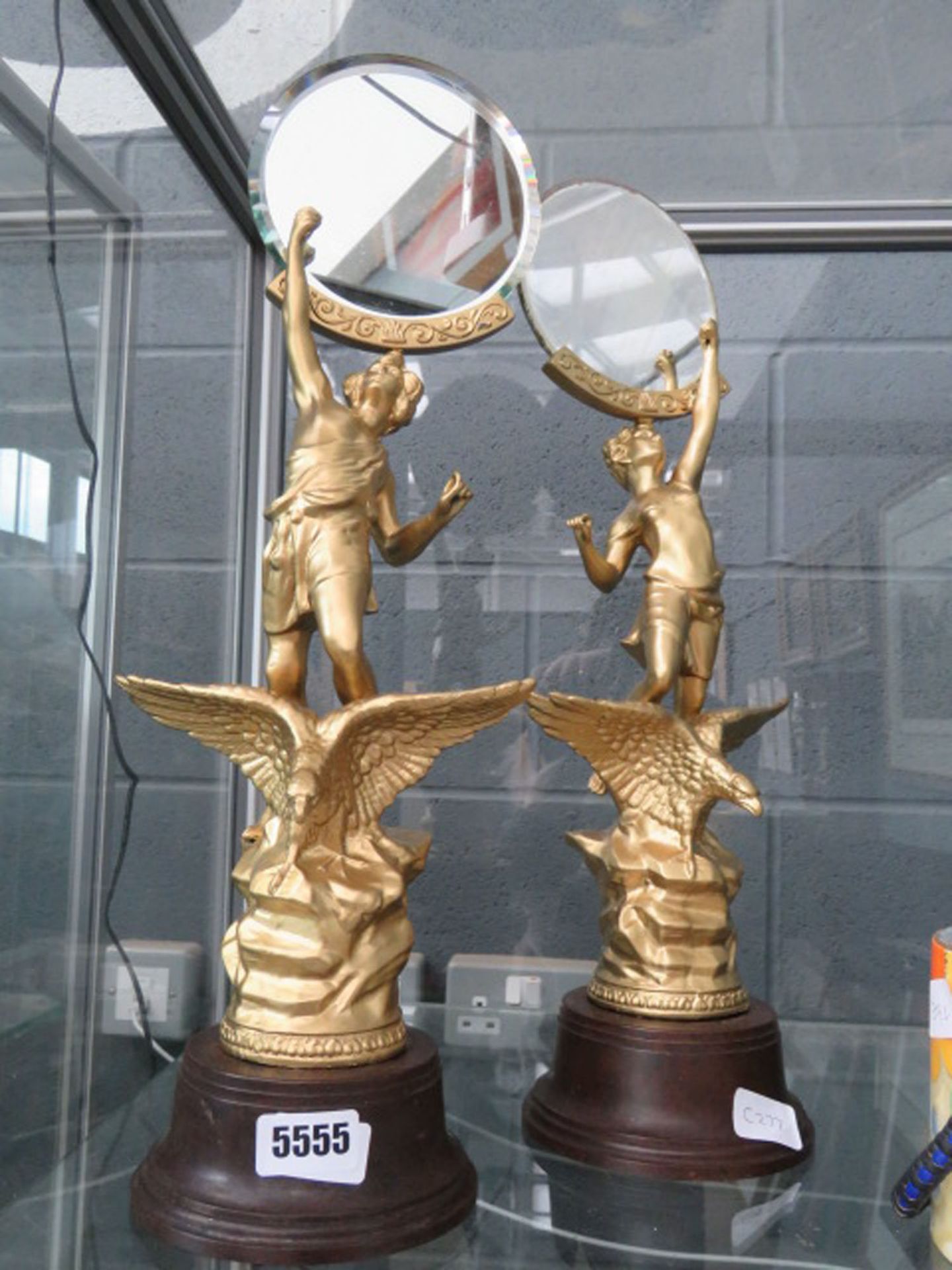 2 gilt spelter figures with eagles to the column