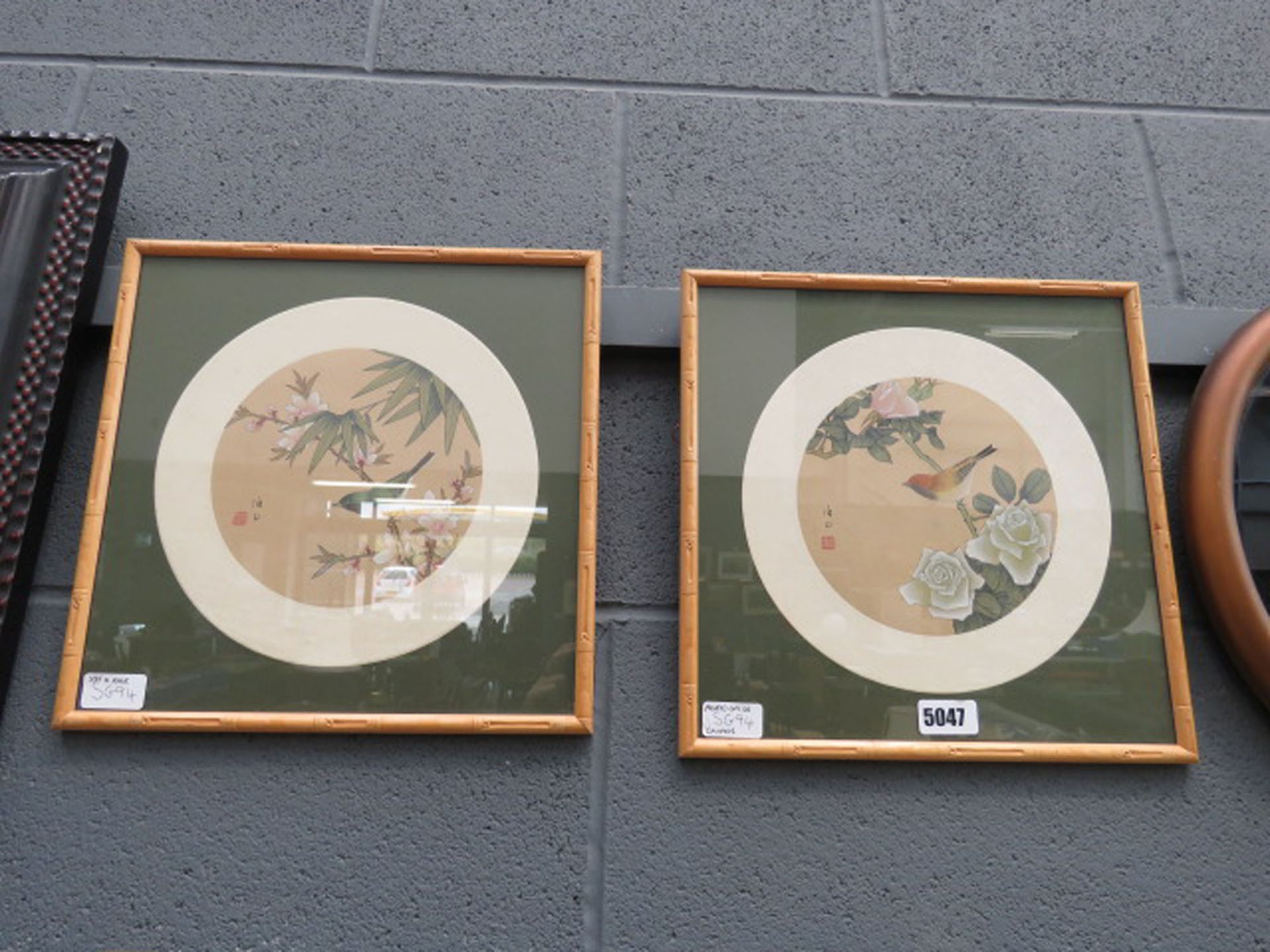 Pair of Chinese prints on silk of birds and foliage