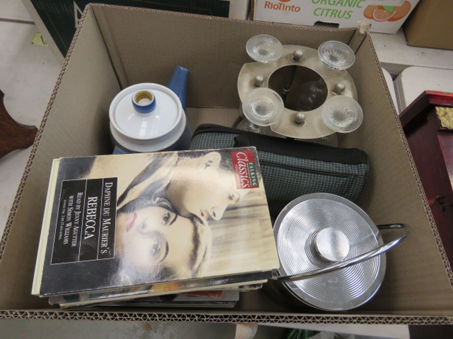 Box containing wine glasses and holder, teapot, classic novels and an ice bucket