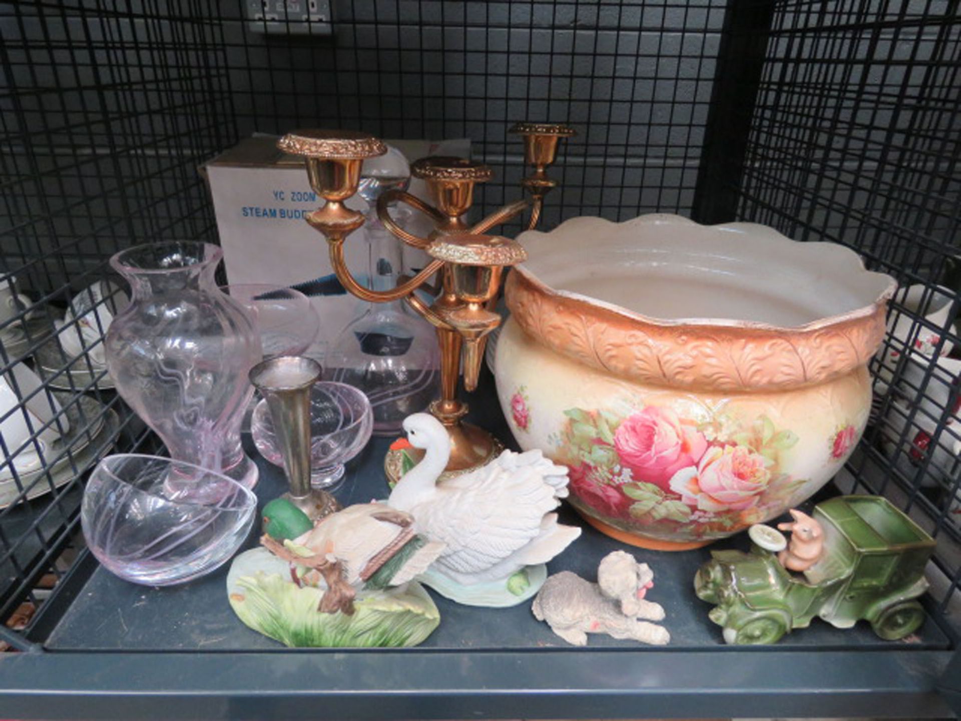Cage containing a rose pattern bowl, 5 branch candlestick, glassware and ornamental figures
