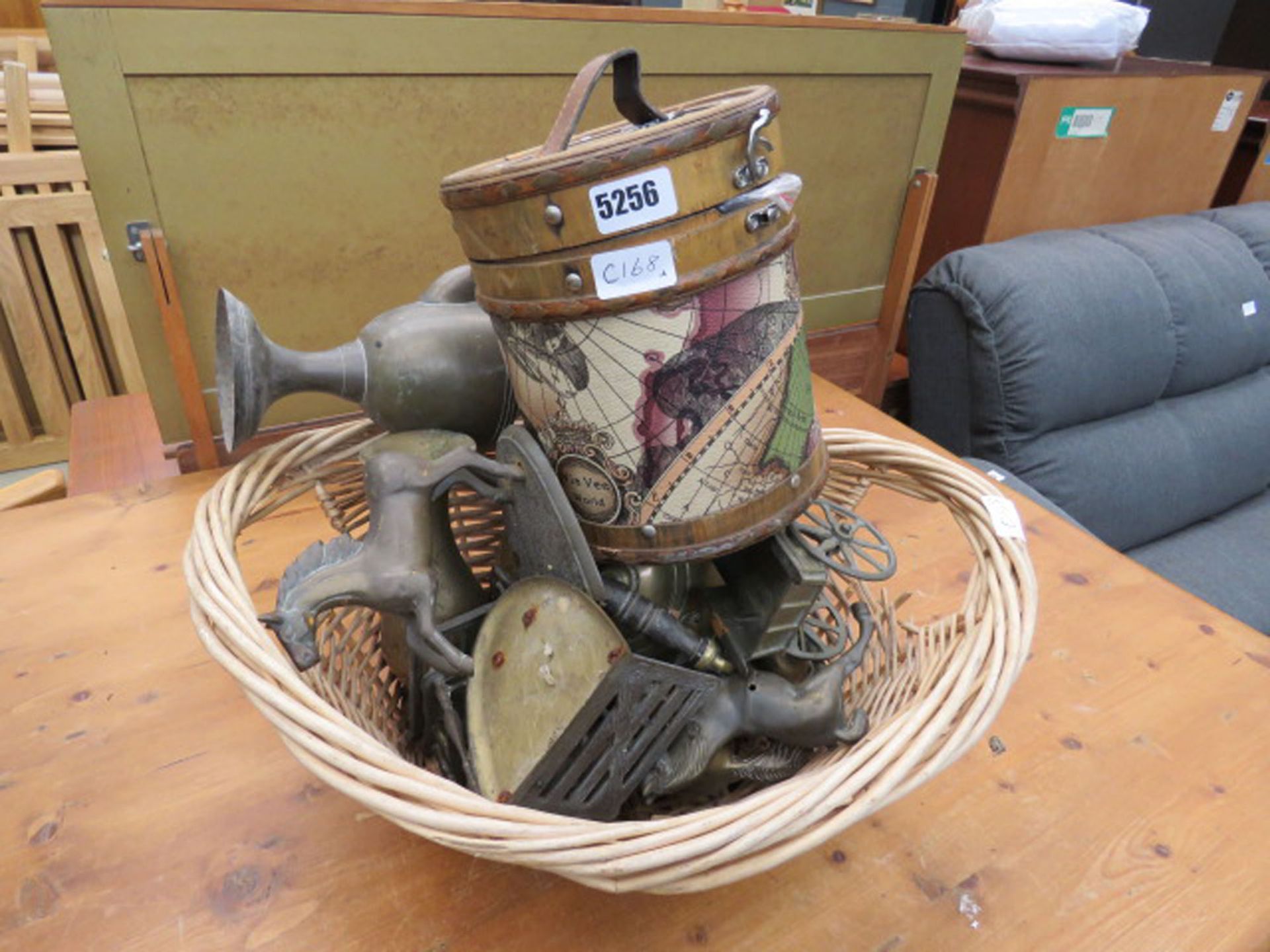 Wicker basket with a quantity of brassware and electric cables