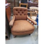 Brown fabric button back armchair stamped T Kettle to the leg