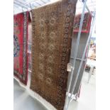 (6) Brown floral rug 192cm by 100cm