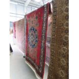 (3) 213x167cm floral carpet with central medallion on red background