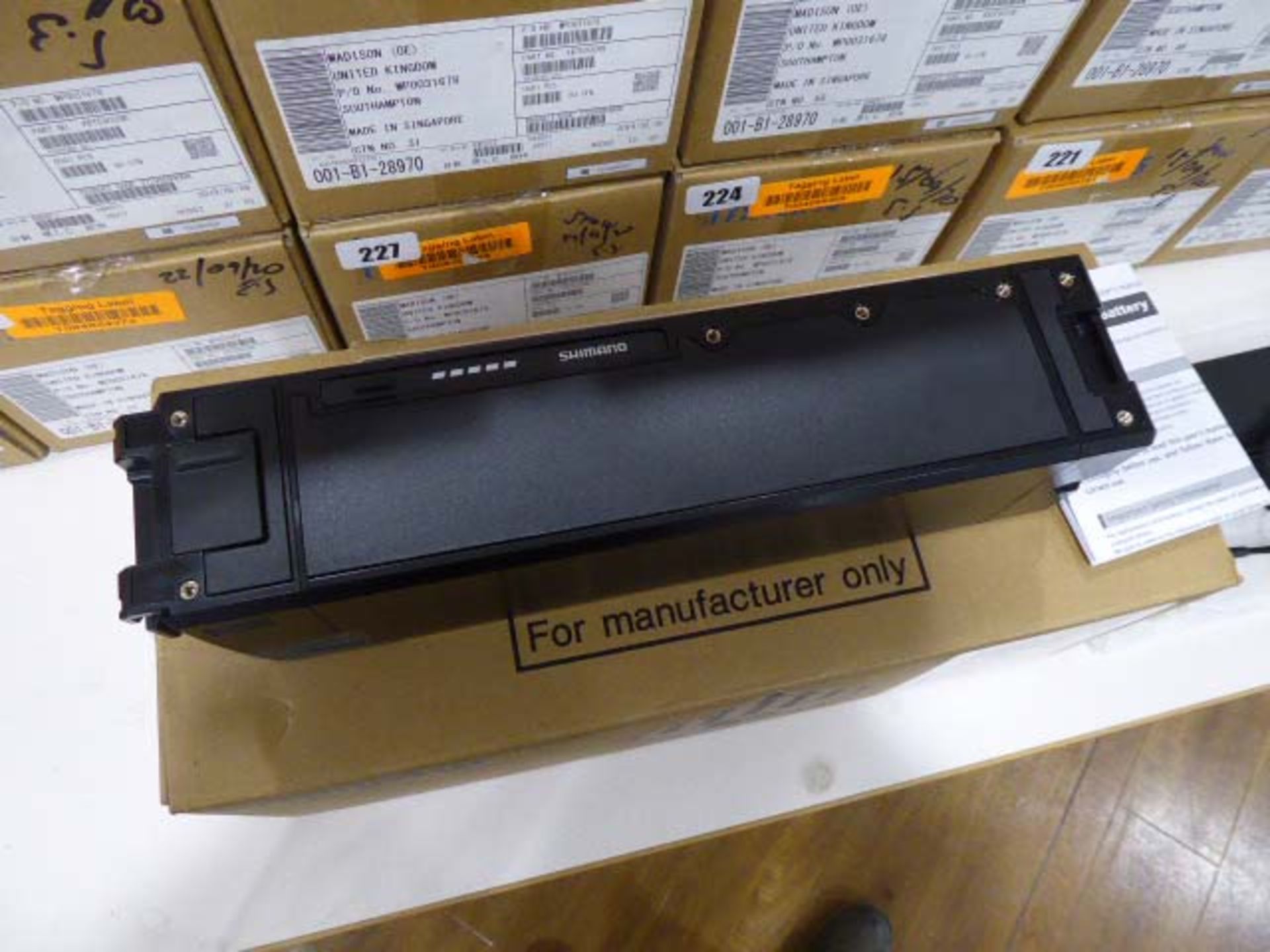 Shimano Model BT-E8020 li-ion battery pack with associated Shimano EC-E6000 charger