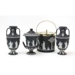 A pair of Wedgwood black and white jasperware two handled vases, h. 17.