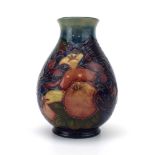 A Moorcroft vase of squat ovoid form decorated in the finches pattern, h.