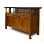 A Commercial Arts & Crafts oak sideboard, the superstructure over two drawers and three drawers,