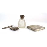 A mixed parcel of silver comprising a vesta case, a dressing table bottle and a bracelet,