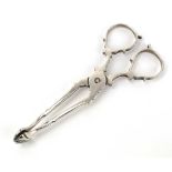 A pair of late 20th century silver sugar tongs with shell ends, maker JBC&S, Birmingham 1972, l. 10.