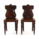 A pair of Victorian mahogany hall chairs, each back bearing insignia for the 3rd Battalian,