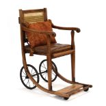 An Edwardian 'Carstairs' wheelchair by J&A Carters Ltd.