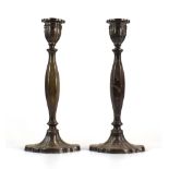 A pair of cast silver candlesticks of knopped form, maker AS, Birmingham 1964, h. 25.