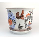 A modern jardiniere and stand decorated with exotic birds on a white ground, d. 21.