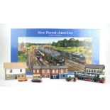 A group of N gauge trackside buildings and vehicles,