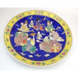 An early/mid 20th century Chinese Export charger decorated with scholars and their students within
