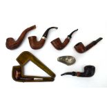 A group of six pipes including a Peterson with a hallmarked band, three other named pipes,