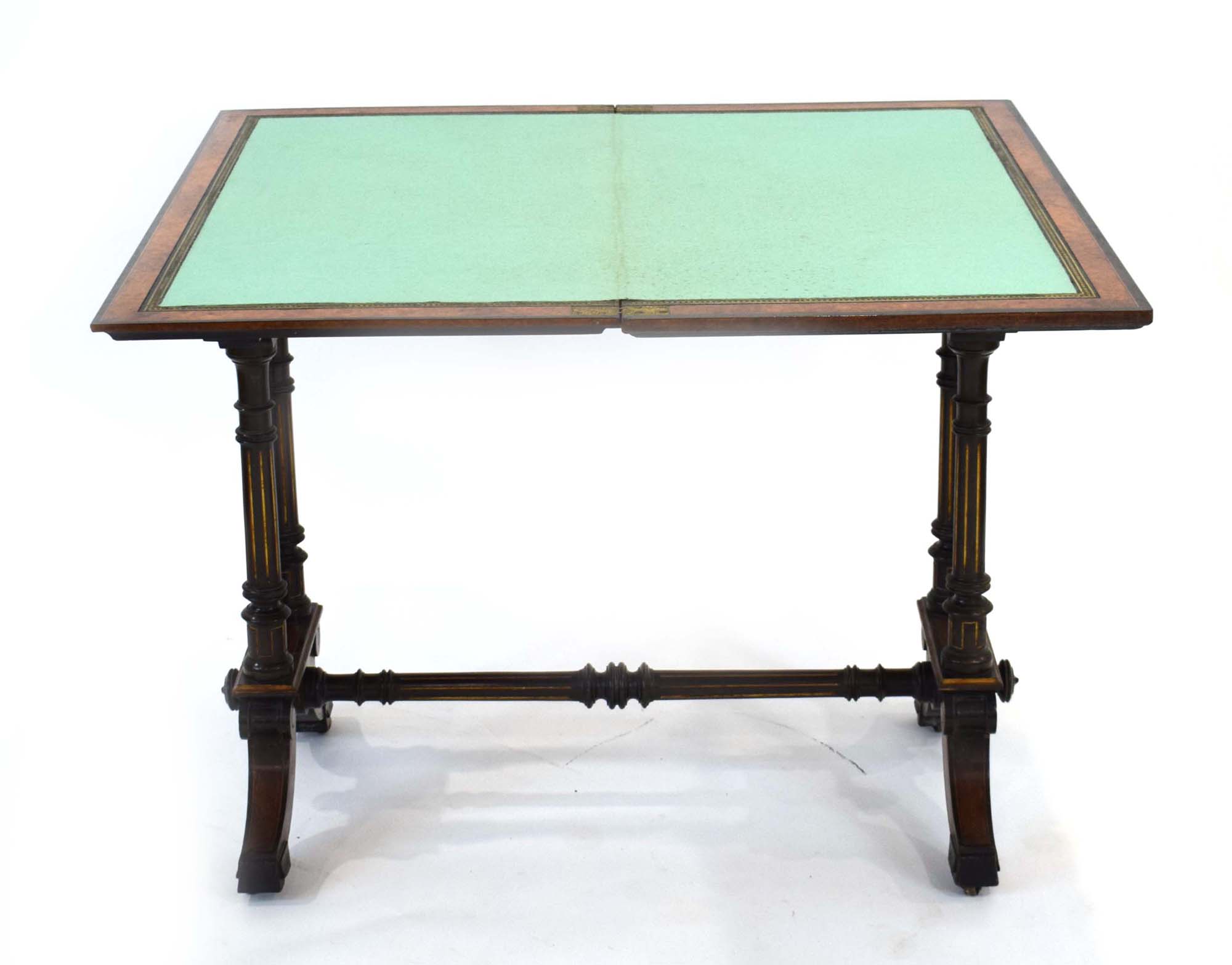 A Gillows side table, the walnut and ebonised top folding to reveal a baize covered games surface, - Image 8 of 9