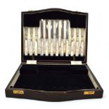 A cased set of six silver bladed and mother of pearl handled dessert knives and forks, maker W&G,