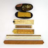 A group of measures including a boxwood rule, a miniature set of scales etc.