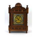A late 19th century oak cased mantel clock, the movement striking on a gong,