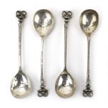 A matched set of four silver teaspoons with serpent ends reading 'Cavendish Golf Club', James Dixon,