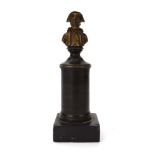 A cold-painted miniature bust of Napoleon, on a brown patinated column and marble base, h.