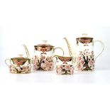 A Royal Crown Derby four piece tea service decorated with flowering shrubs, max h.