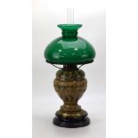 A ceramic oil lamp decorated with swags and birds,