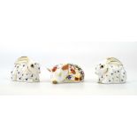 Three Royal Crown Derby paperweights modelled as a piglet and a pair of rabbits, max h. 4.