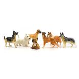 Six Beswick figures, each modelled as a dog including a boxer, two Alsatians and others,