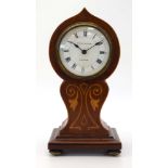 An early 20th century mantle timpiece retailed by Muirhead & Arthur of Glasgow within a mahogany