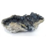 A large pale blue quartz geode,