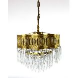 A pair of early/mid 20th century three tier waterfall chandeliers of Neo-Classical design, w.