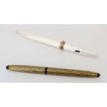 A white enamelled Sheaffer fountain pen inset with red and clear stones together with a gilt