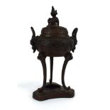 A Chinese brown patinated bronze covered censer of typical form with foo dog finial above a pair of