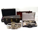 A group of cased instruments including a silver-plated trumpet by JR Lafleur & Son,